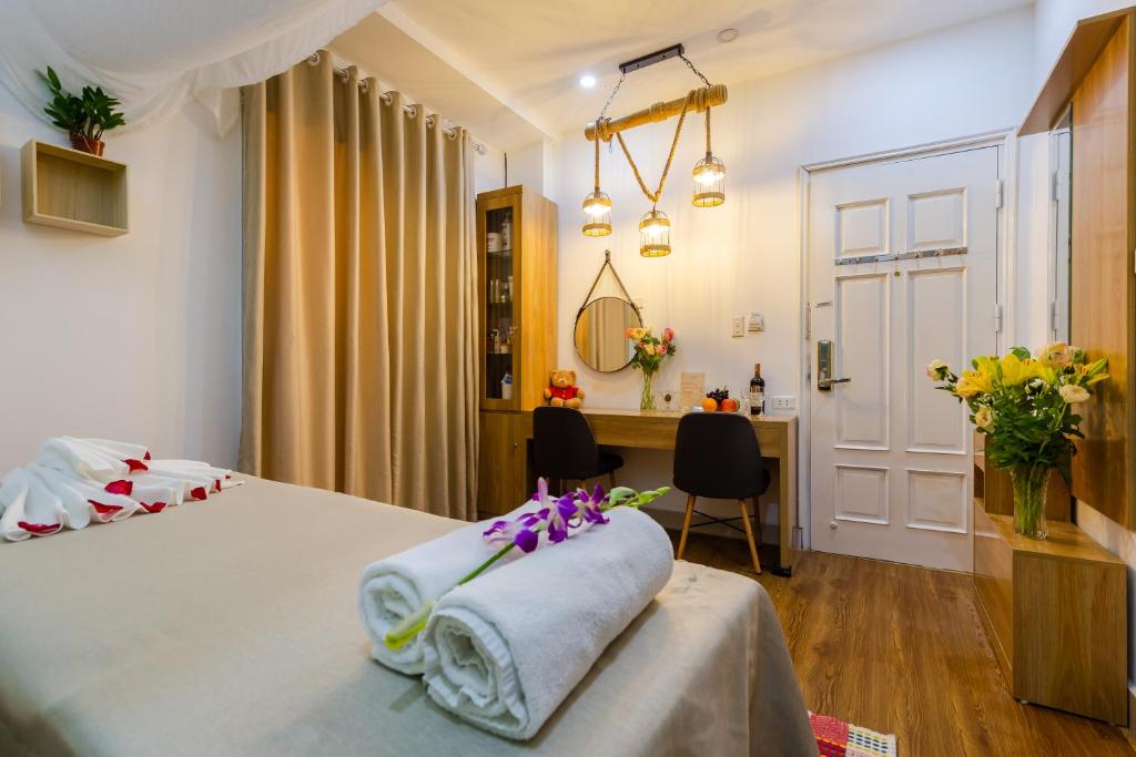 Postel nebo postele na pokoji v ubytování An Phú Hà Nội Hotel & Spa - Mỹ Đình