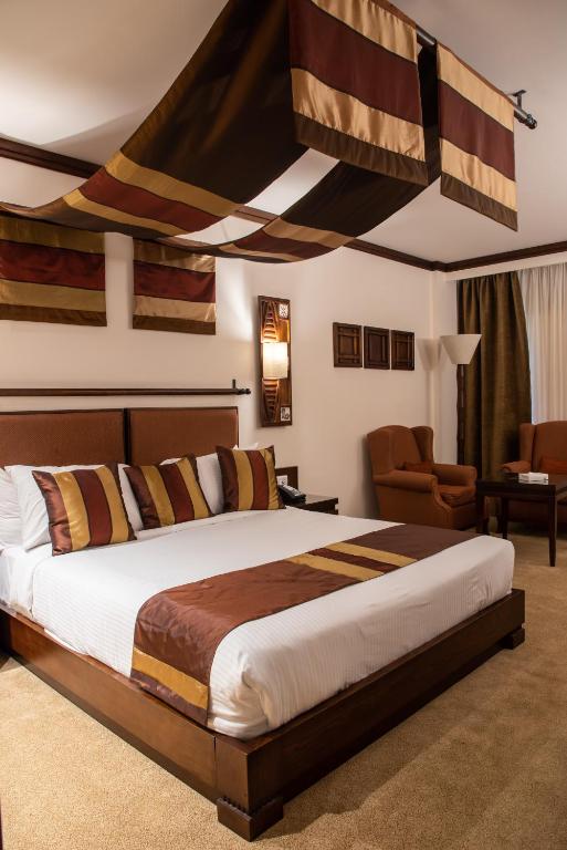 Postel nebo postele na pokoji v ubytování Africana Hotel & Spa