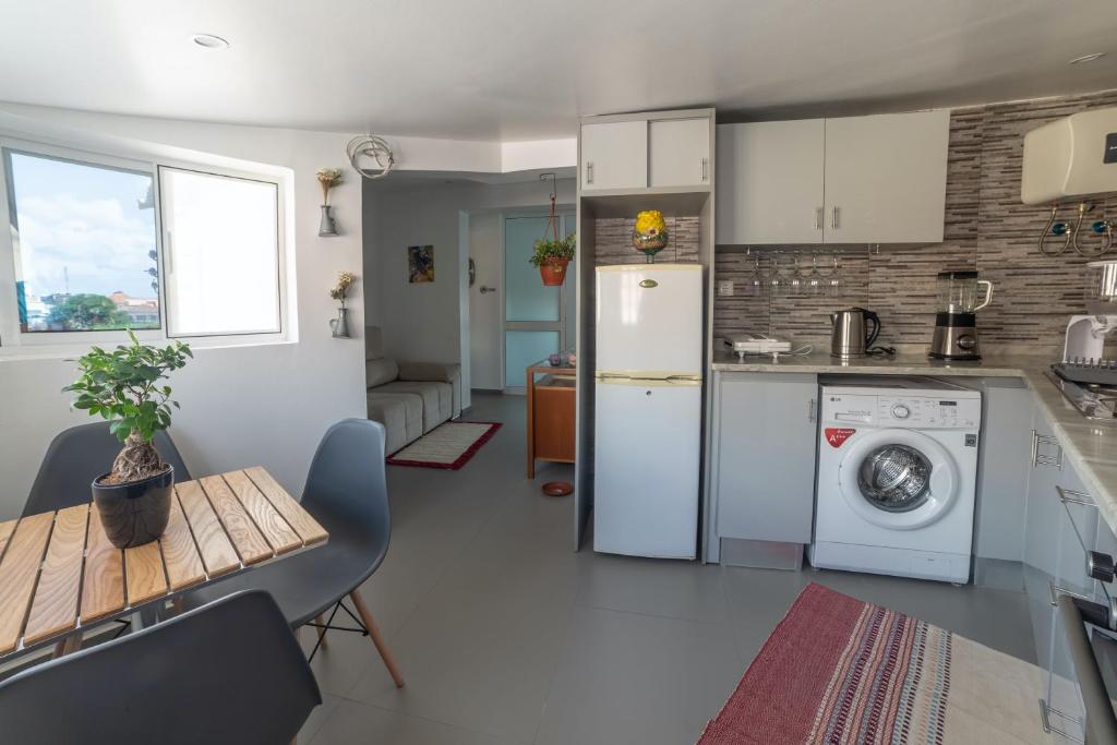 Kuchyň nebo kuchyňský kout v ubytování A Casa da Mizi