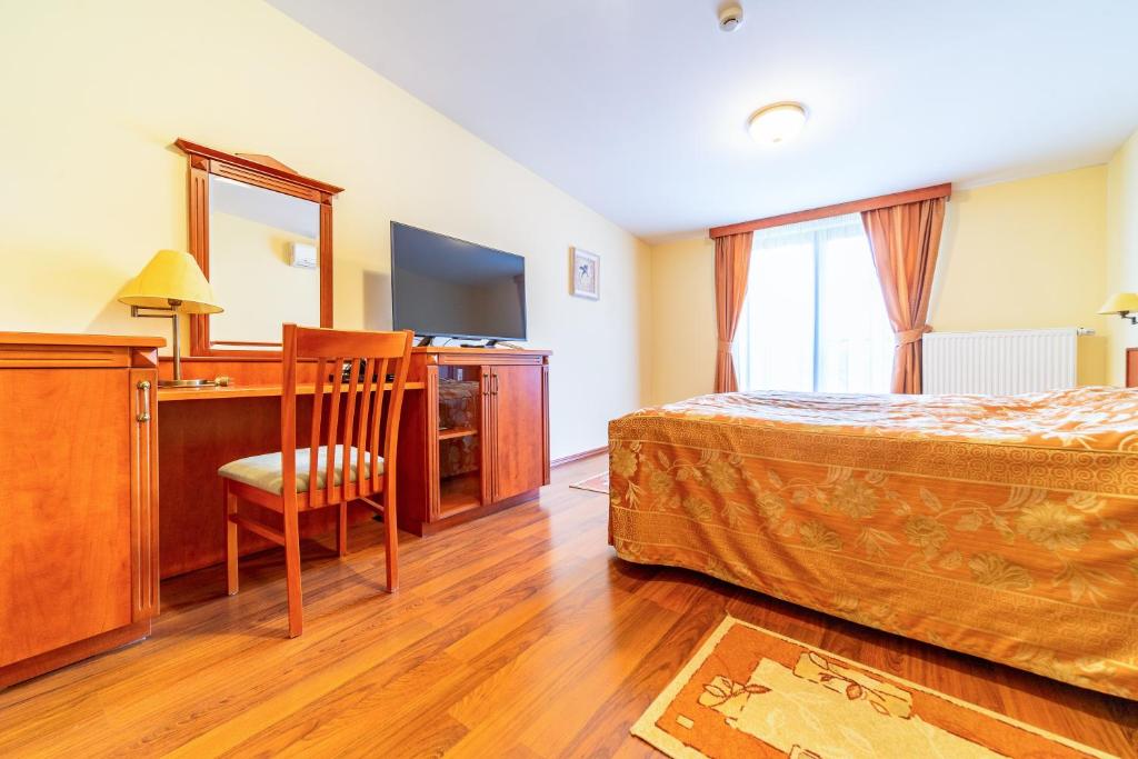 Postel nebo postele na pokoji v ubytování Pannon Hotel Bejelentkezés 20 óráig, Check-in until 20 o'clock, Einchecken bis 20 Uhr