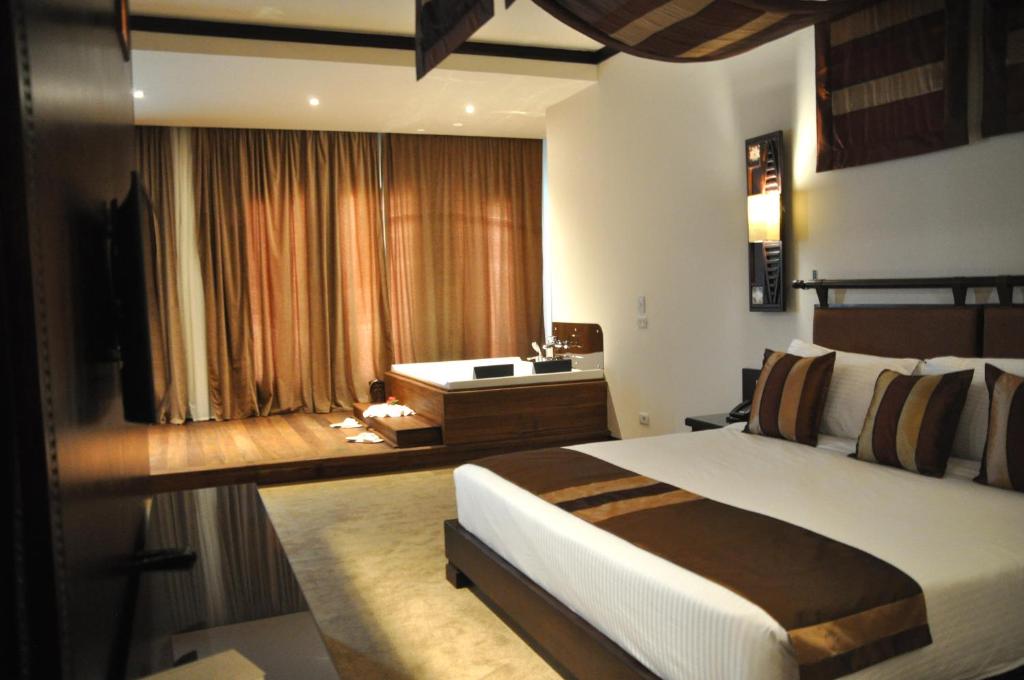 Postel nebo postele na pokoji v ubytování Africana Hotel & Spa