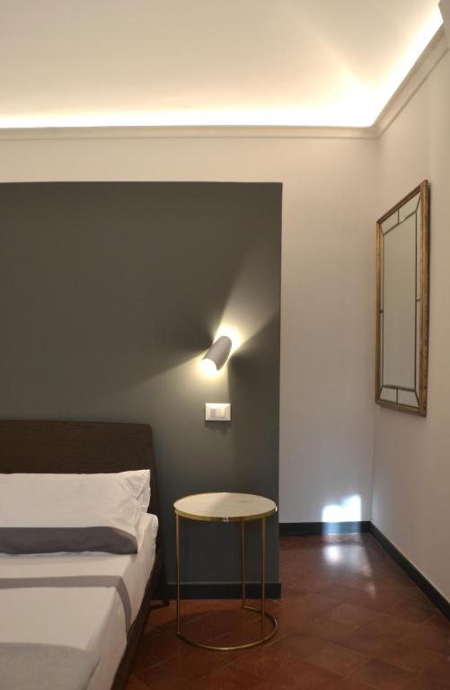 Postel nebo postele na pokoji v ubytování Da Domè Charm Rooms
