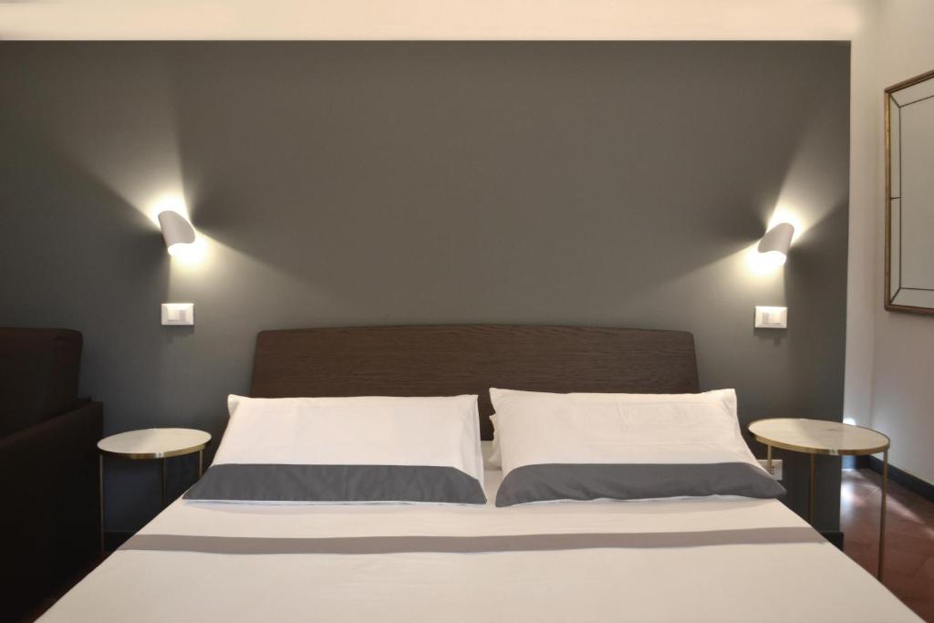 Postel nebo postele na pokoji v ubytování Da Domè Charm Rooms
