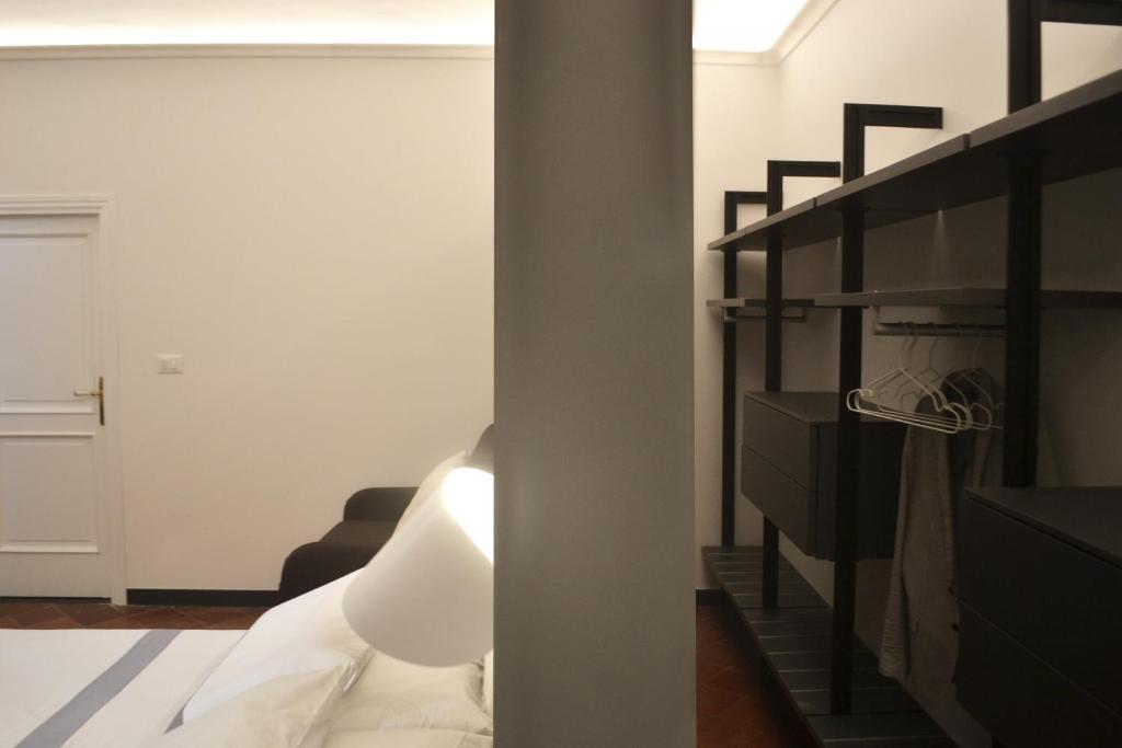 Postel nebo postele na pokoji v ubytování Da Domè Charm Rooms