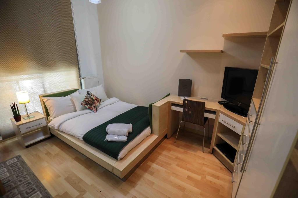 Postel nebo postele na pokoji v ubytování Sky Suites