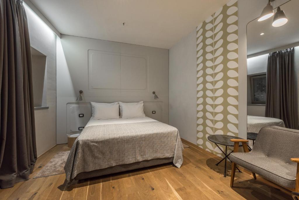 Postel nebo postele na pokoji v ubytování Hotel Peteani