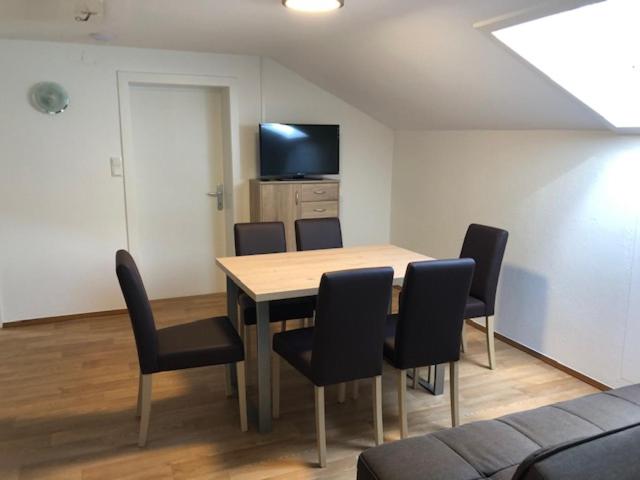 a dining room with a table and chairs at Kienburg in Matrei in Osttirol