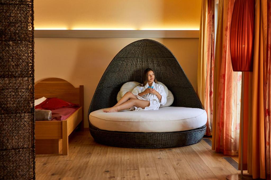 Postel nebo postele na pokoji v ubytování Mountain Hotel Mezdì