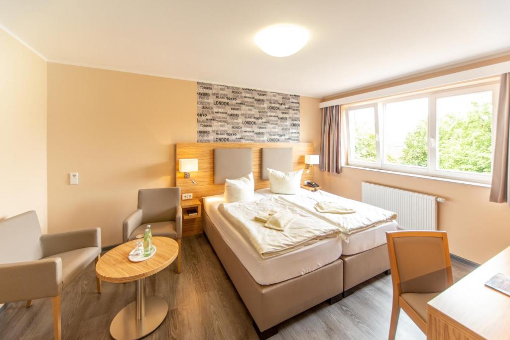 Postel nebo postele na pokoji v ubytování Hotel Rügenblick