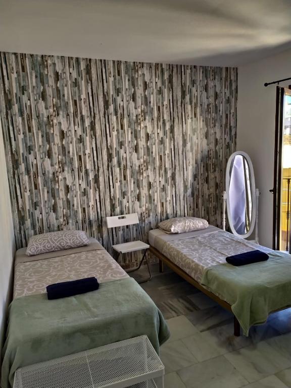 Posteľ alebo postele v izbe v ubytovaní Málaga Centro Hostel