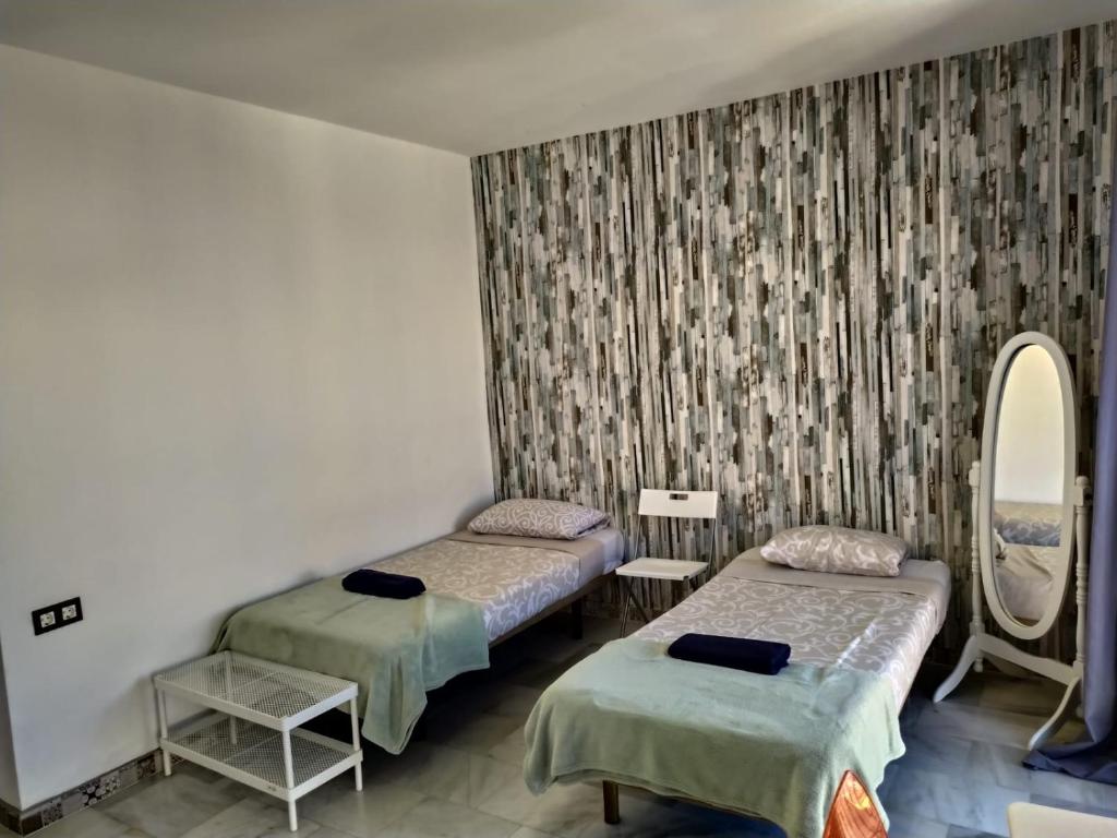 Posteľ alebo postele v izbe v ubytovaní Málaga Centro Hostel