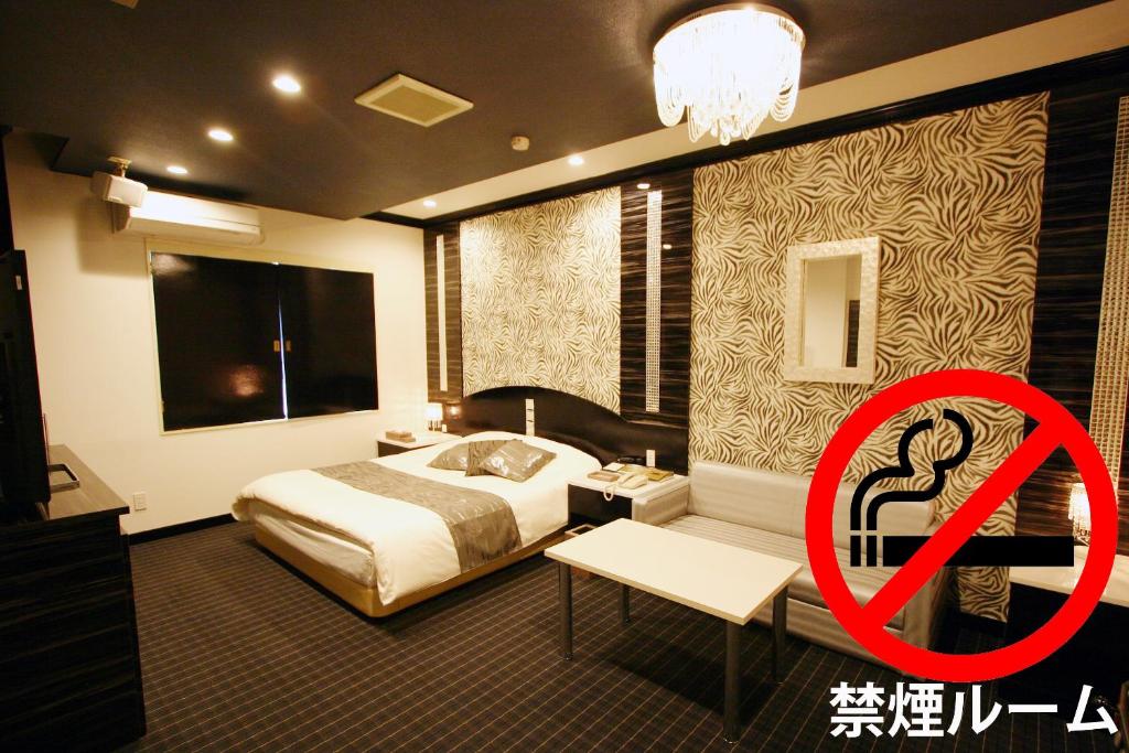 Postel nebo postele na pokoji v ubytování ホテルレックス諏訪 -レジャーホテル -