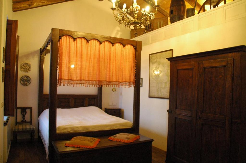A bed or beds in a room at La Corte Di Gerardo