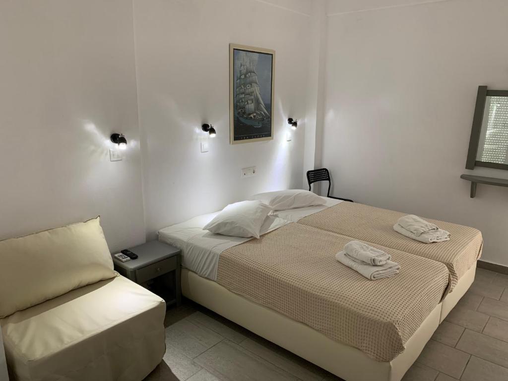 Postel nebo postele na pokoji v ubytování Deep Blue Rooms & Apartments