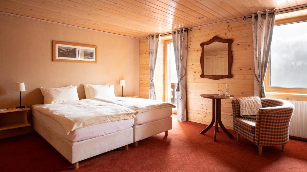 Postel nebo postele na pokoji v ubytování Hotel Suisse