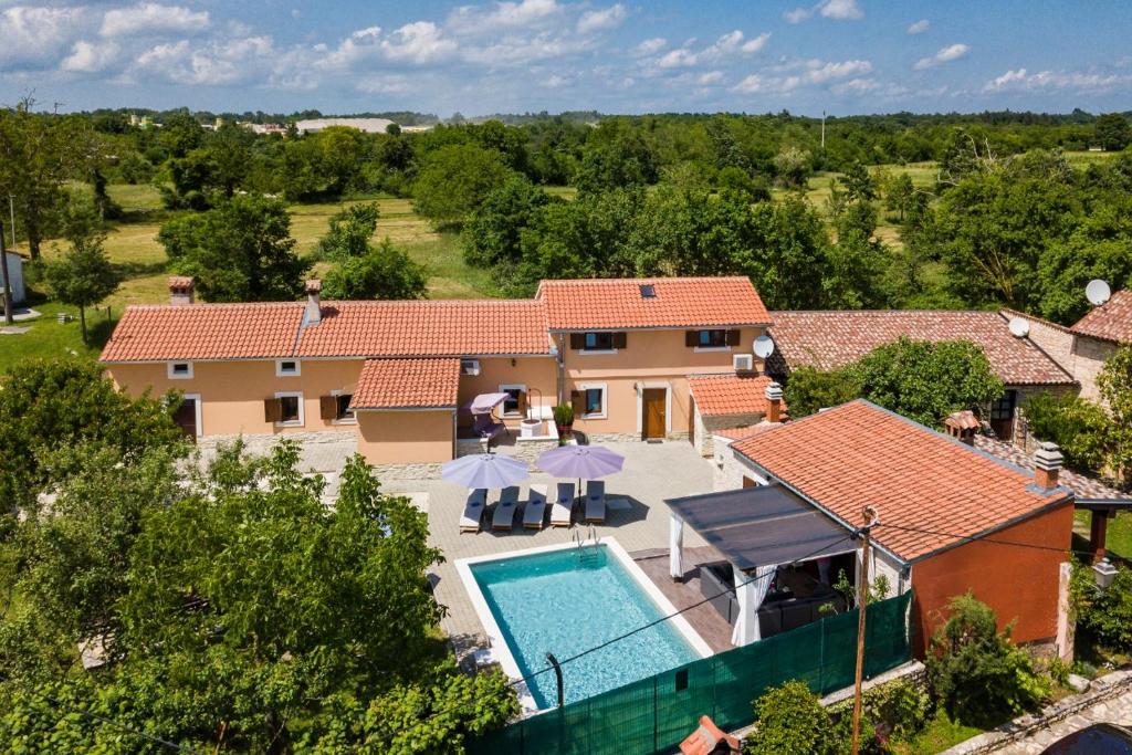an aerial view of a house with a swimming pool at Villa Zvane in Žminj