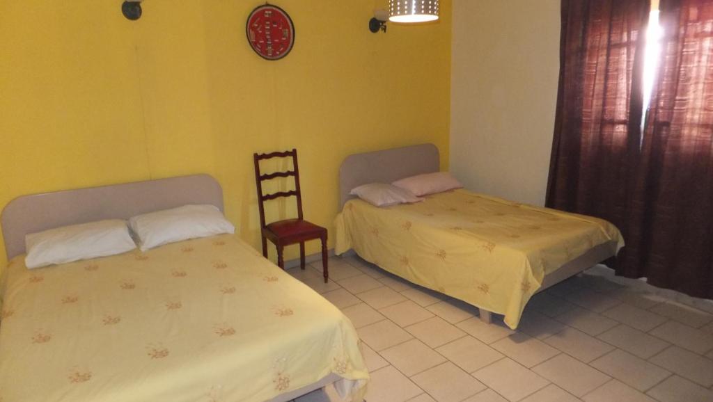 Postel nebo postele na pokoji v ubytování Dookee House