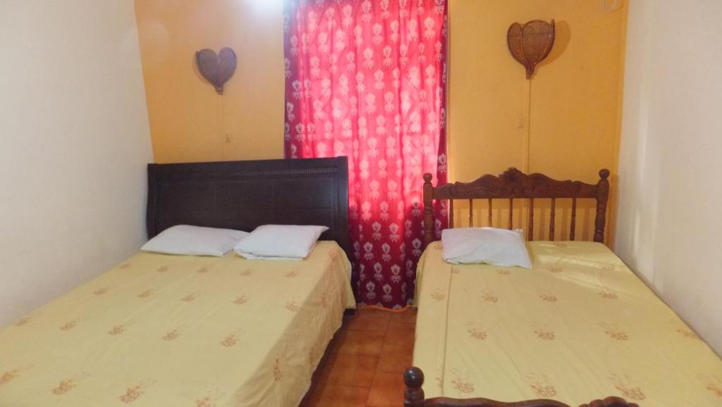 Postel nebo postele na pokoji v ubytování Dookee House