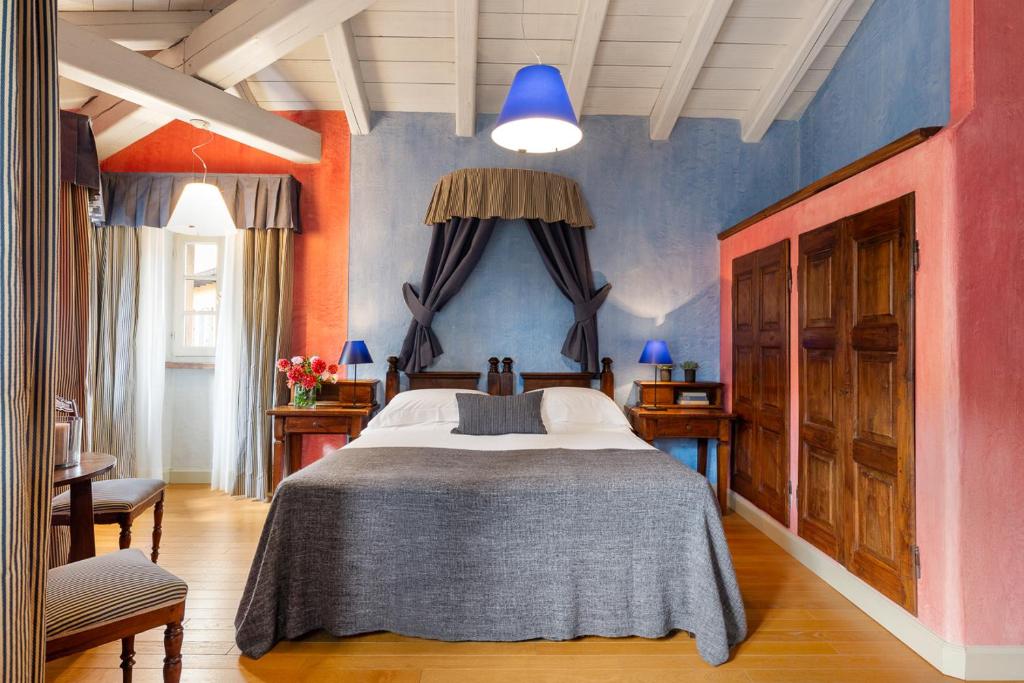 Postel nebo postele na pokoji v ubytování Hotel Pironi