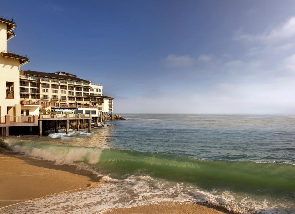 a beach scene with a large body of water at Monterey Plaza Hotel & Spa in Monterey