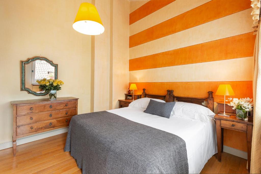 Postel nebo postele na pokoji v ubytování Hotel Pironi