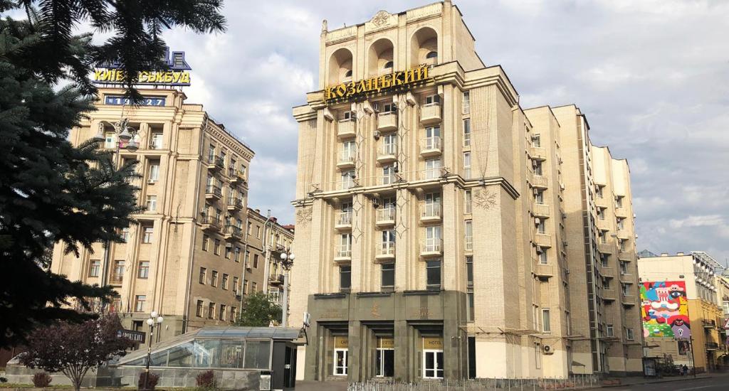 a large building with a clock tower on top of it at Kozatskiy Hotel in Kyiv