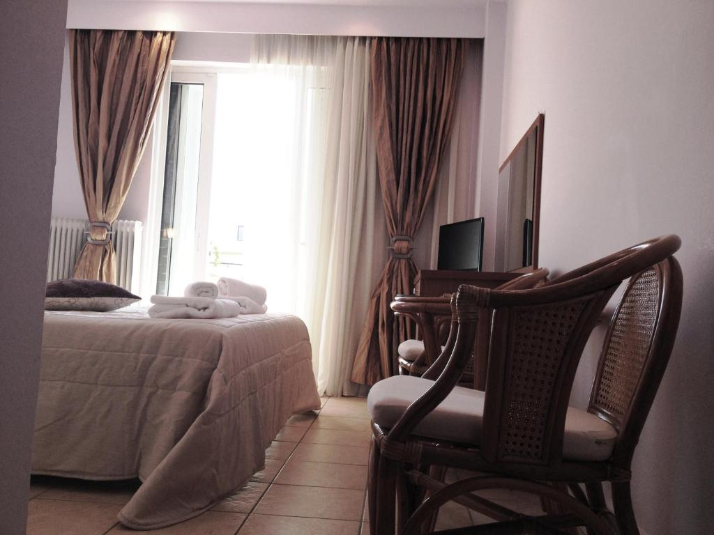 Postel nebo postele na pokoji v ubytování Souris Hotel