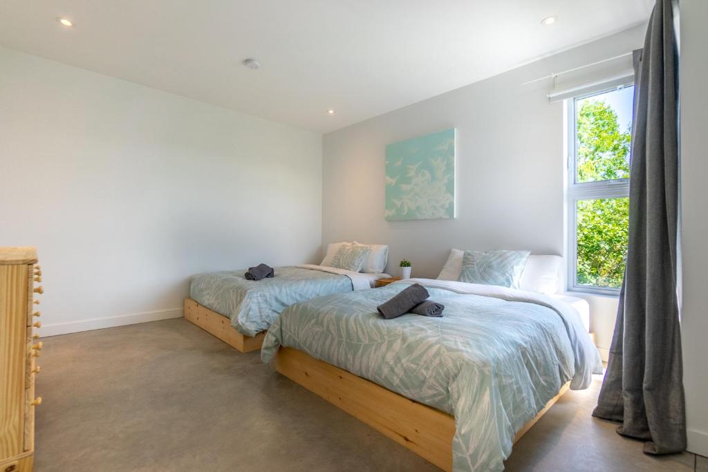 Postel nebo postele na pokoji v ubytování Hôtel-Appartements de la Gare