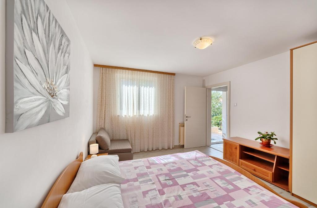 Postel nebo postele na pokoji v ubytování Apartmani MARINA