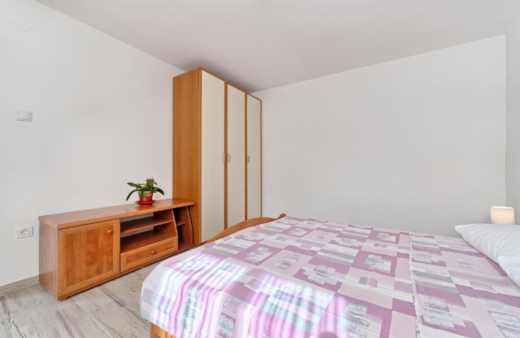 Postel nebo postele na pokoji v ubytování Apartmani MARINA