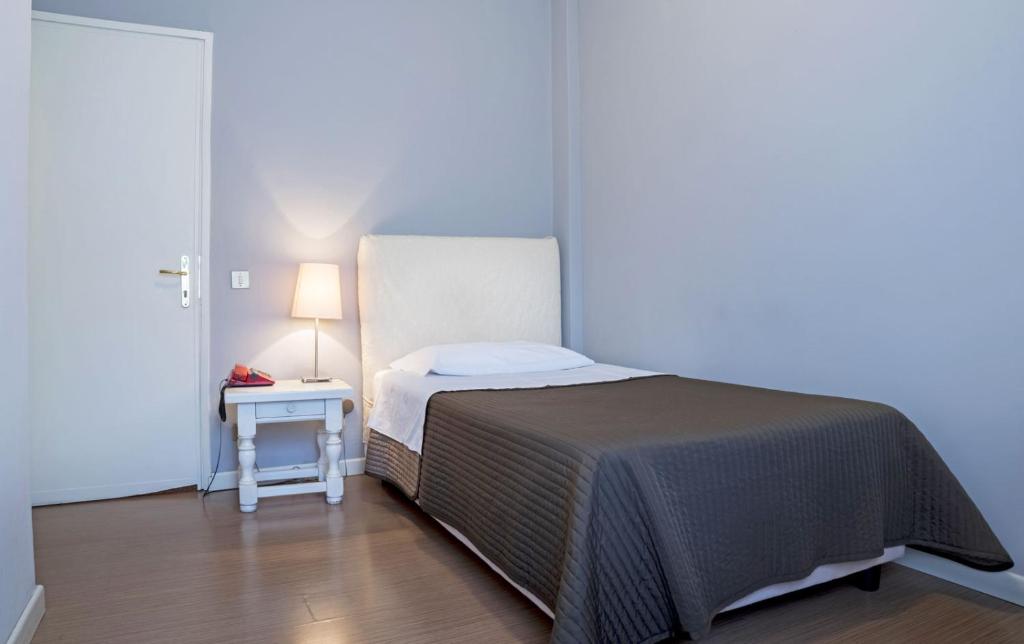 Postel nebo postele na pokoji v ubytování Hotel Positano