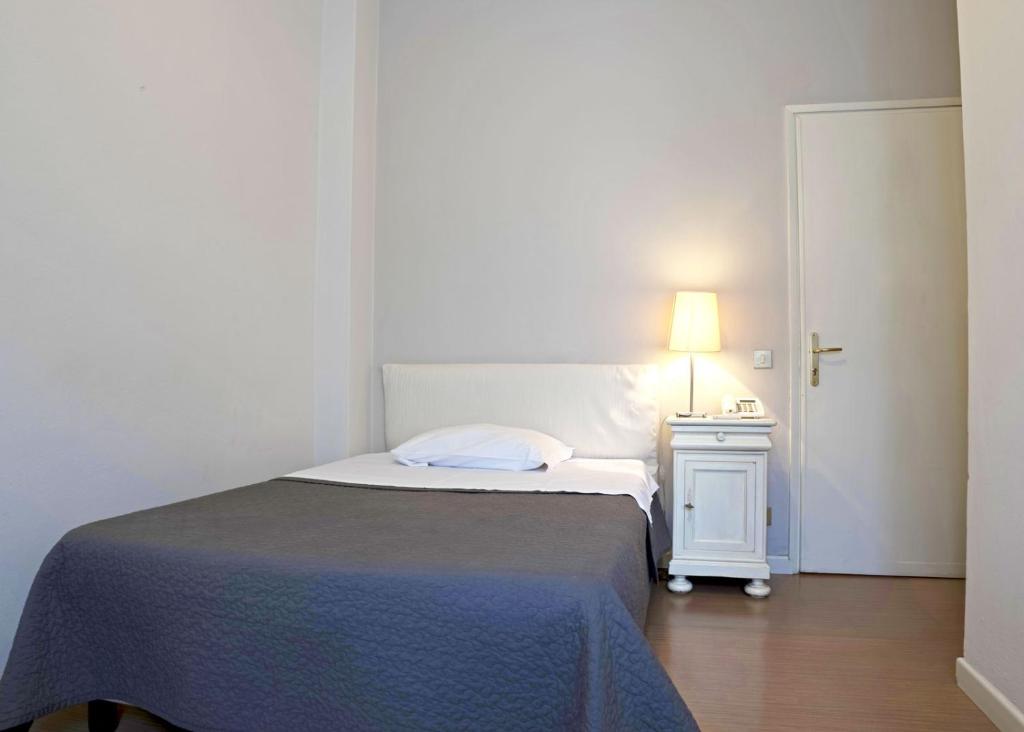 Postel nebo postele na pokoji v ubytování Hotel Positano