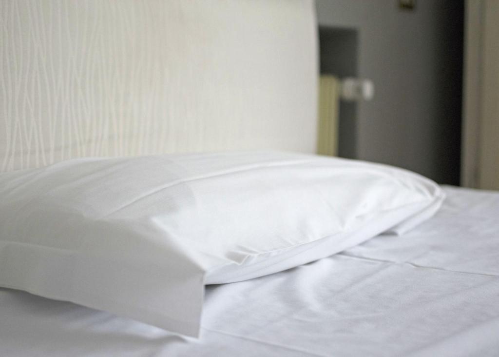 Postel nebo postele na pokoji v ubytování Hotel Positano