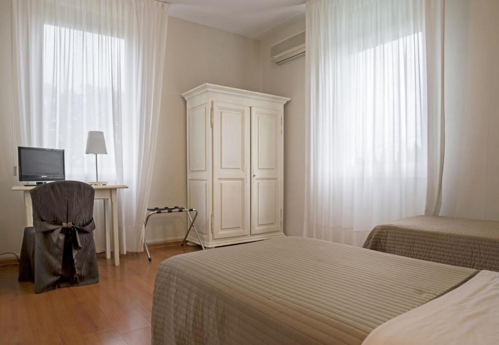 Postel nebo postele na pokoji v ubytování Hotel Positano