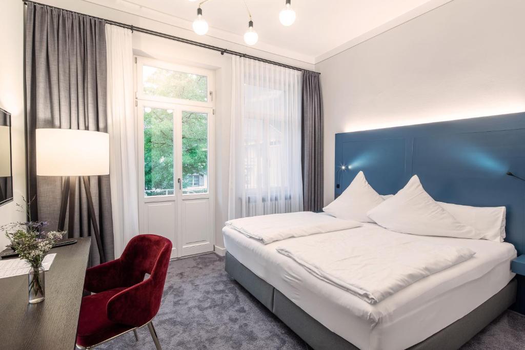 Postel nebo postele na pokoji v ubytování Villa Rein Boutiquehotel