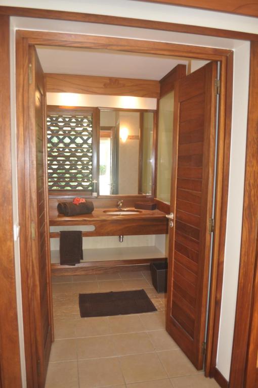 a bathroom with a sink and a mirror at ROYAL BORA BORA in Bora Bora