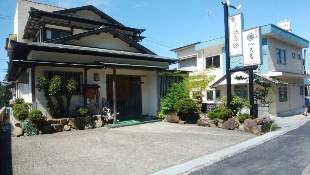 a building on the side of a street at Ikuta / Vacation STAY 53359 in Haneda