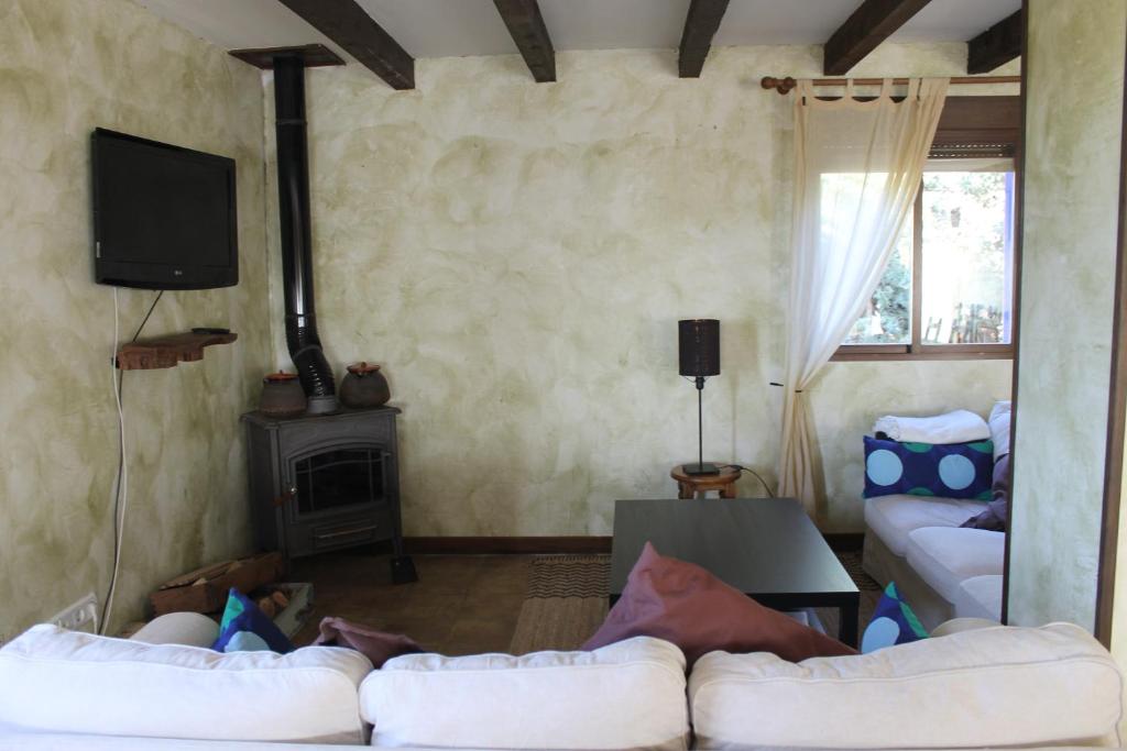En eller flere senge i et værelse på Casa Rural Baobab