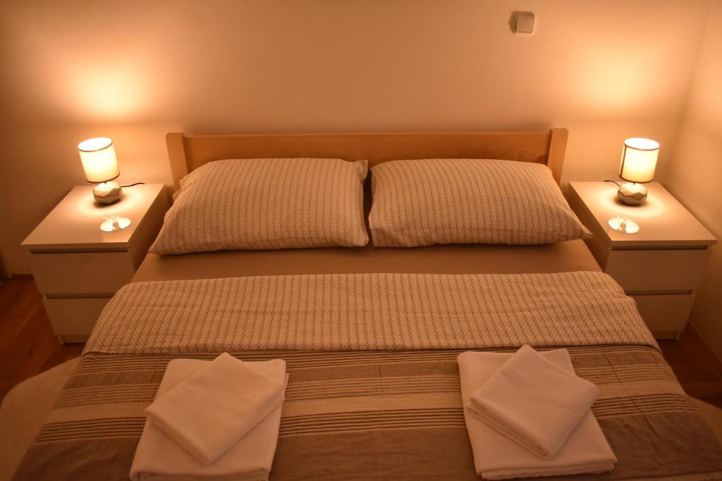 Postel nebo postele na pokoji v ubytování Apartman BoNi