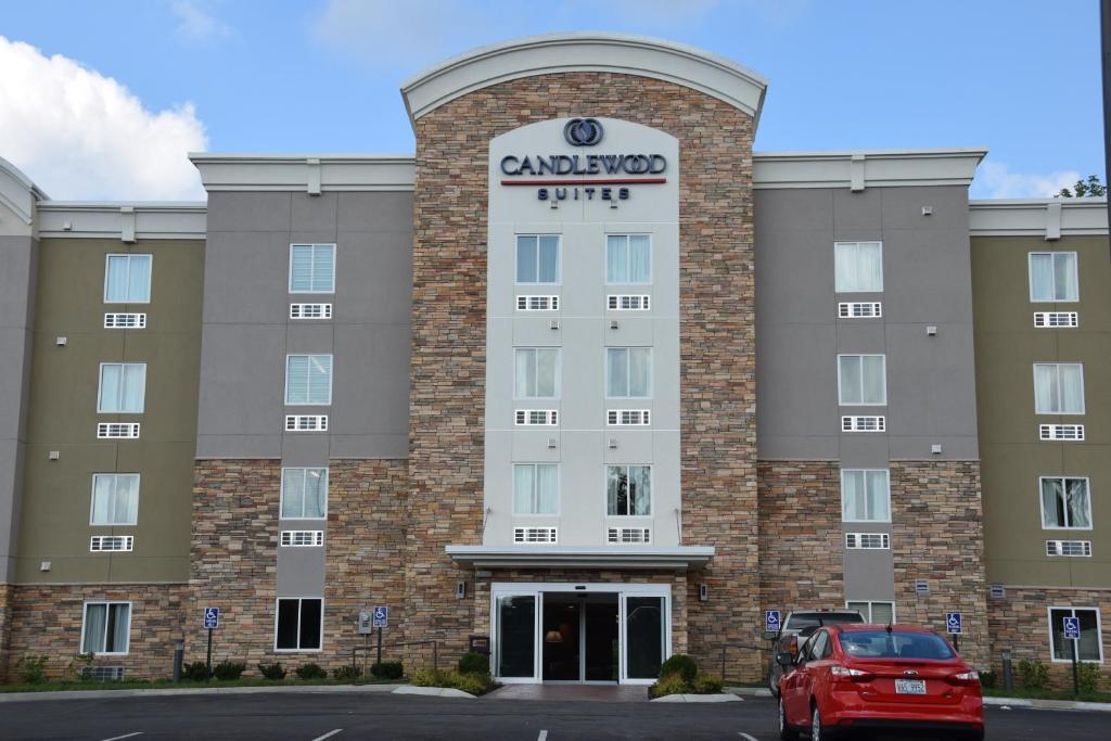 a building with a car parked in front of it at Candlewood Suites Nashville - Goodlettsville, an IHG Hotel in Goodlettsville