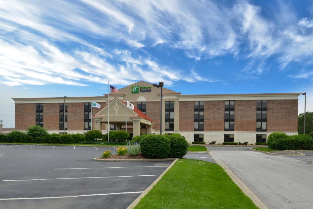 a large building with a clock on the front of it at Holiday Inn Express Crestwood, an IHG Hotel in Crestwood