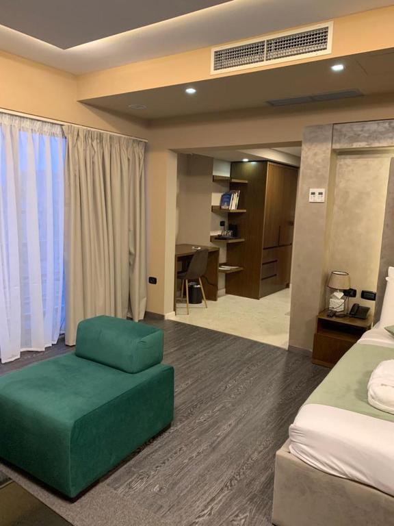 Postel nebo postele na pokoji v ubytování Albanopolis Hotel