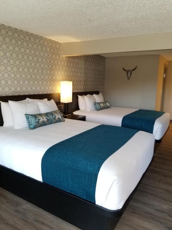 מיטה או מיטות בחדר ב-The Hotel Y