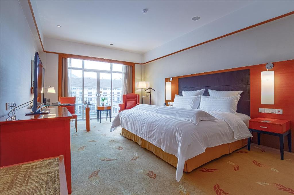 Postel nebo postele na pokoji v ubytování Pullman Zhangjiajie Hotel - Instagrammable