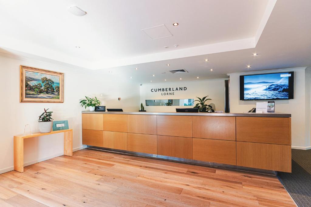 a waiting room with a reception desk at Cumberland Lorne Resort in Lorne