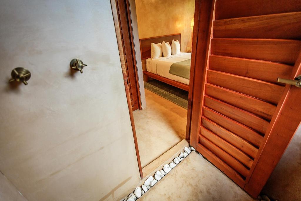 Postel nebo postele na pokoji v ubytování Hotel Carolina Bacalar