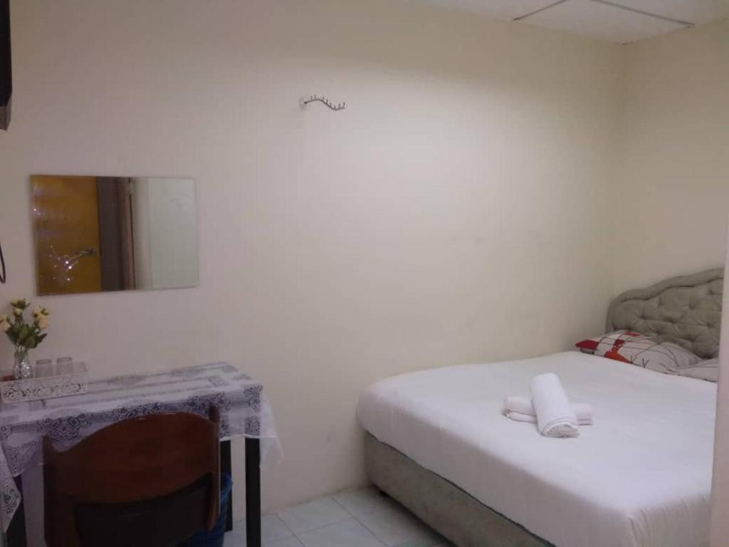 Postel nebo postele na pokoji v ubytování Hotel Tropicanna Pulai Point