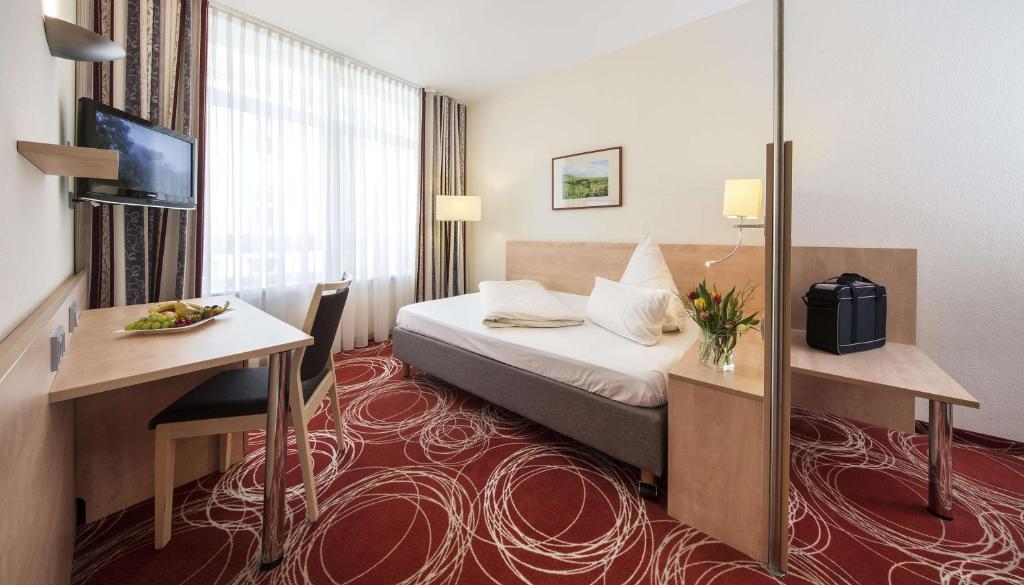 Postel nebo postele na pokoji v ubytování Hotel Löwengarten