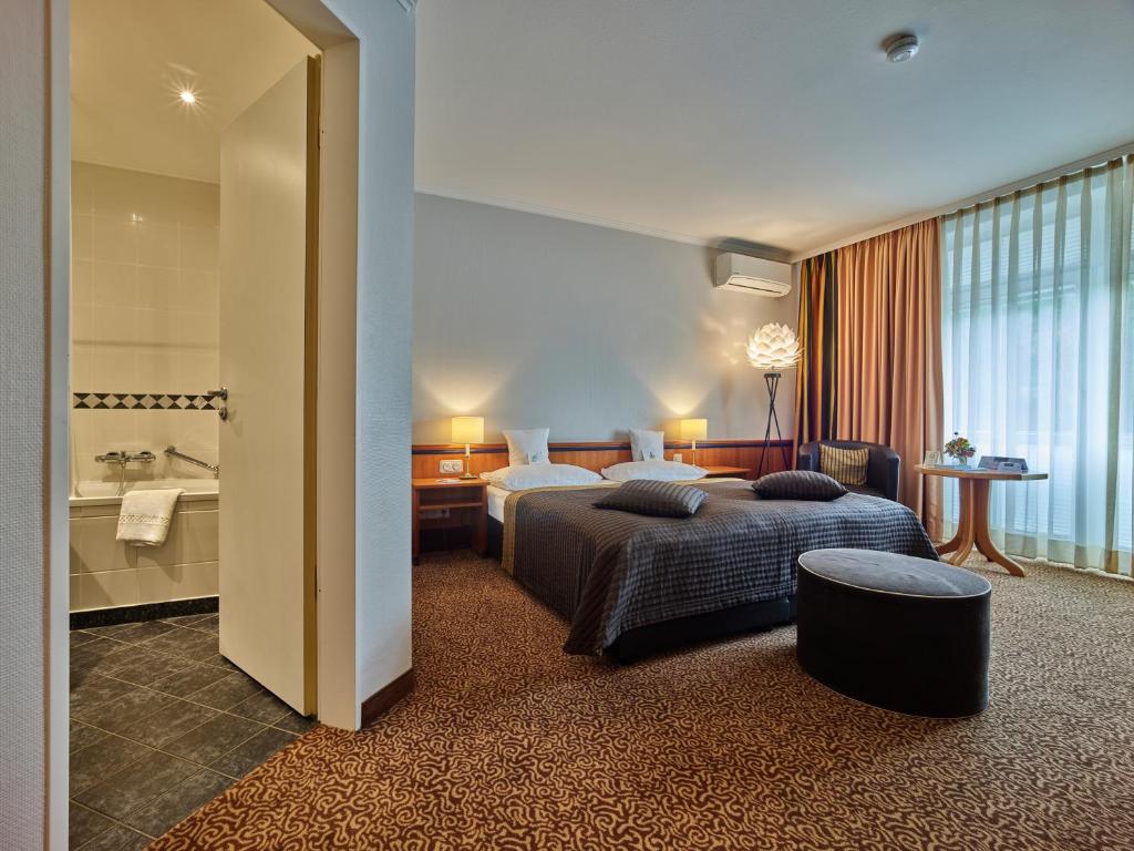 Postel nebo postele na pokoji v ubytování Tandreas Hotel & Restaurant