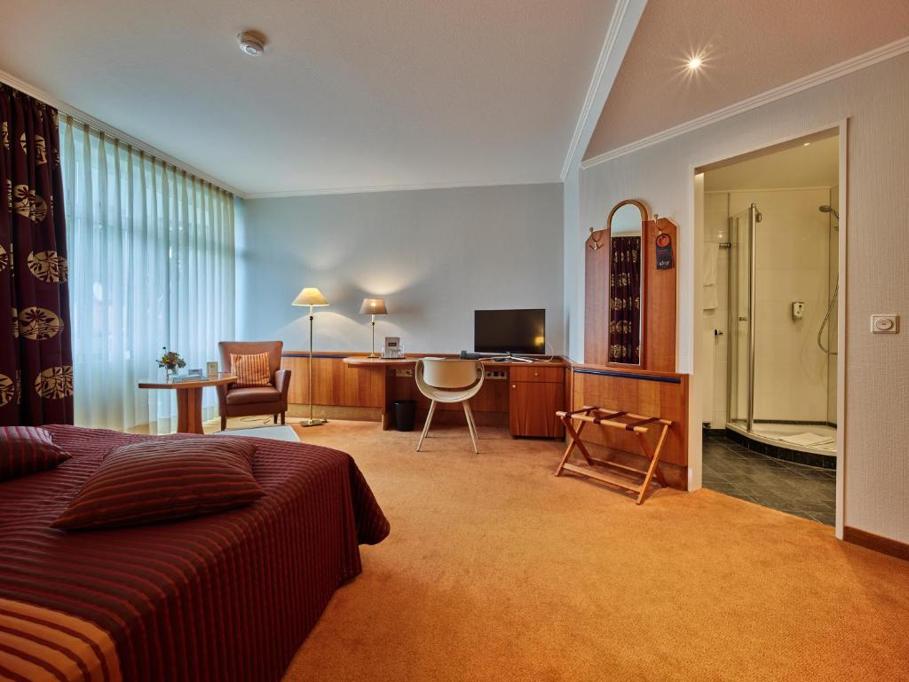 TV a/nebo společenská místnost v ubytování Tandreas Hotel & Restaurant
